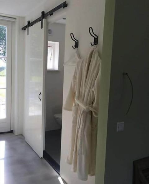 Apartment, 1 Bedroom, Garden Area | Bathroom amenities | Shower, free toiletries, slippers, towels