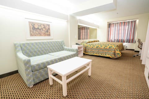 Deluxe Room, 1 King Bed, Nonsmoking | In-room safe, iron/ironing board, free WiFi, bed sheets