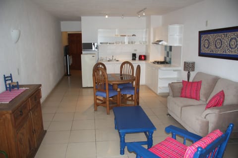 Apartment, 1 Bedroom, Partial Ocean View | Living area | 32-inch flat-screen TV with cable channels, TV