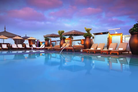 Outdoor pool, open 8:00 AM to 9:00 PM, cabanas (surcharge)