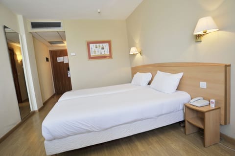 Standard Room, 2 Twin Beds | In-room safe, desk, iron/ironing board, free WiFi