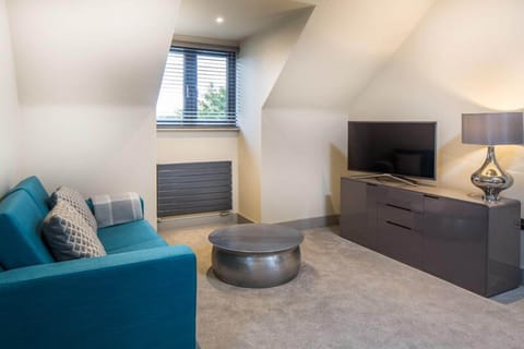 Deluxe Suite, Private Bathroom | Laptop workspace, blackout drapes, soundproofing, iron/ironing board