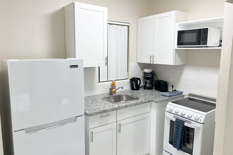 Family Apartment, 1 Bedroom | Private kitchen | Fridge, microwave, coffee/tea maker, electric kettle