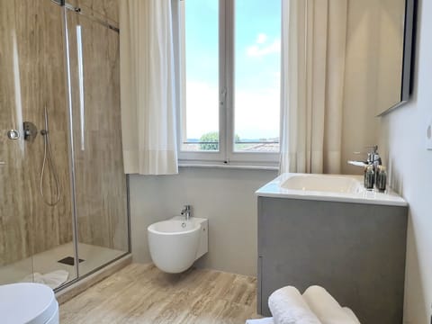 Shower, hair dryer, slippers, towels