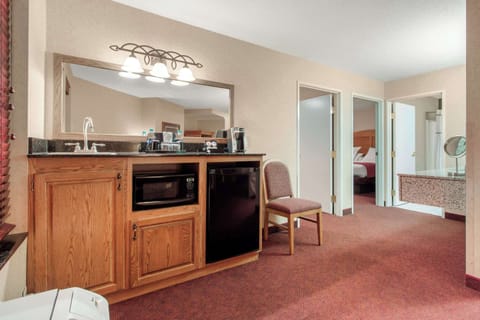 Suite, Multiple Beds, Non Smoking | Desk, laptop workspace, blackout drapes, iron/ironing board