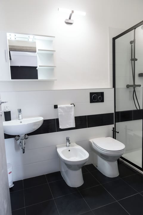 Triple Room | Bathroom | Shower, hair dryer, towels, soap