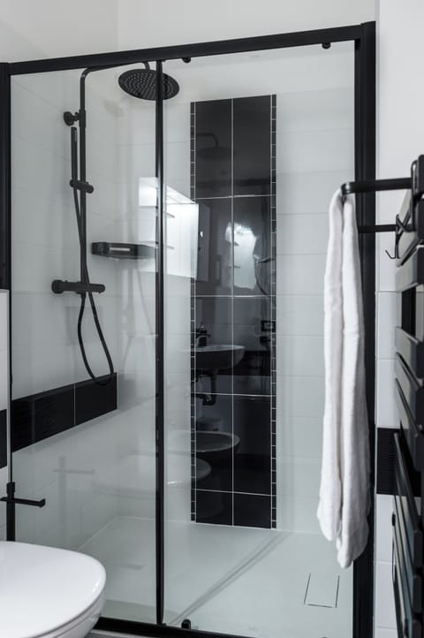 Triple Room | Bathroom | Shower, hair dryer, towels, soap