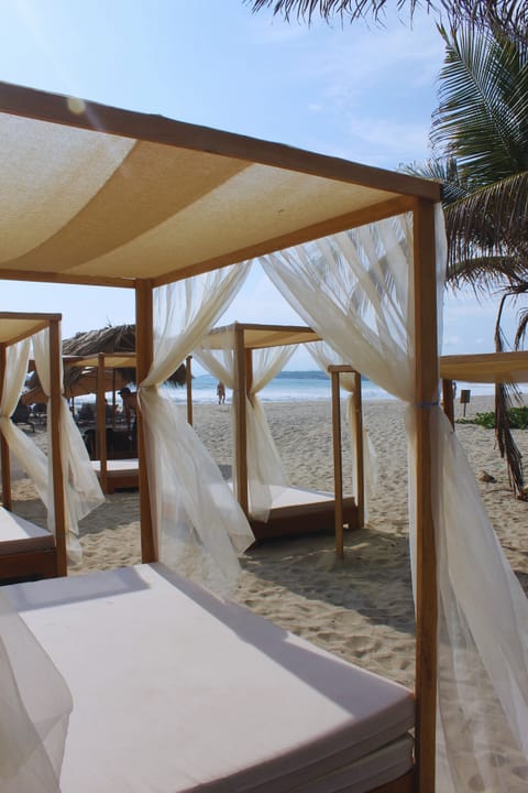 On the beach, sun loungers, beach umbrellas, beach towels