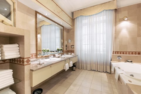 Luxury Suite, 1 Bedroom (Calvin) | Bathroom | Free toiletries, hair dryer, bathrobes, slippers