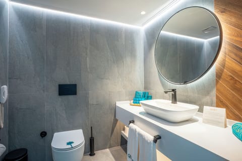 Shower, hair dryer, slippers, towels