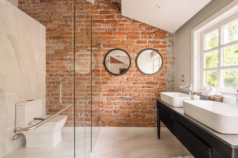 Shower, designer toiletries, hair dryer, bathrobes