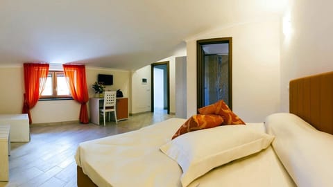 Deluxe Triple Room, Garden View | Premium bedding, minibar, in-room safe, individually decorated