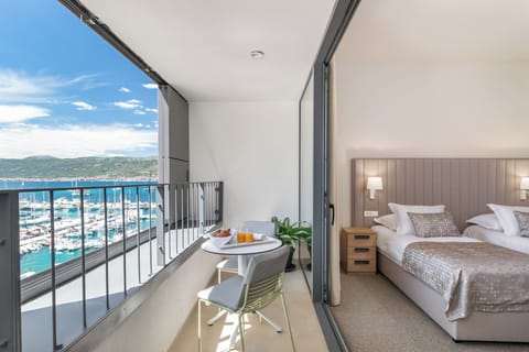 Deluxe Double or Twin Room, Balcony, Sea View | Minibar, in-room safe, desk, blackout drapes