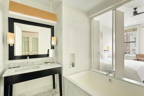 Studio | Bathroom | Separate tub and shower, jetted tub, hydromassage showerhead, hair dryer