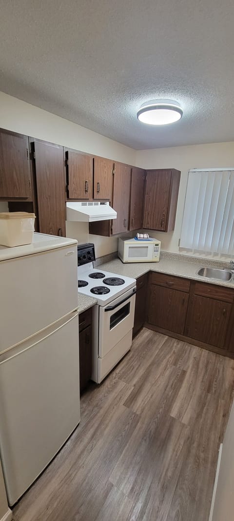 Suite, 2 Queens with a separate 1 Bedroom, Kitchen (Non-PetFriendly) | Private kitchen | Fridge, microwave, coffee/tea maker, cleaning supplies