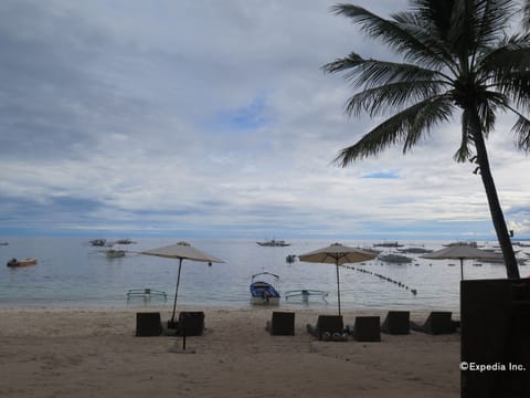 On the beach, sun loungers, beach umbrellas, beach towels