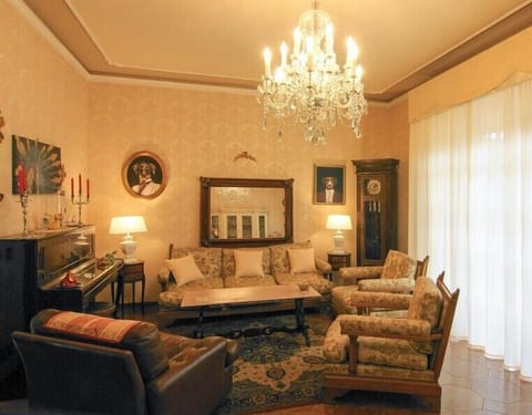 Apartment, Balcony, City View | Living area | 32-inch flat-screen TV with cable channels