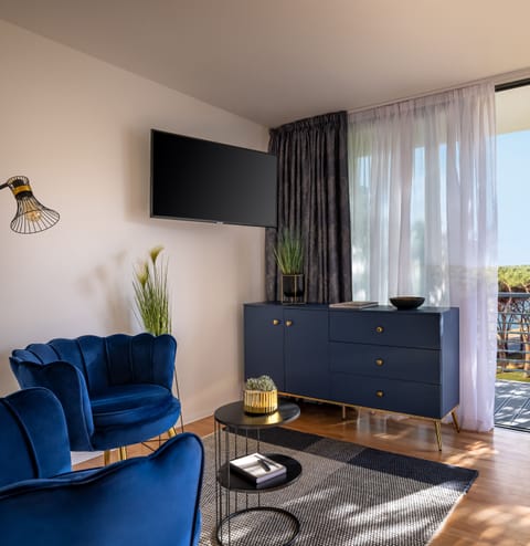 Deluxe Double Room, Balcony, Garden View | Living area | 30-inch Smart TV with satellite channels