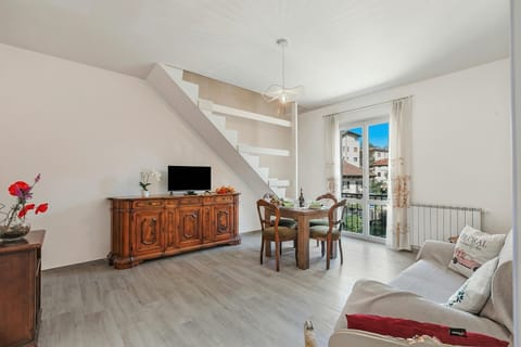 Family Apartment, Multiple Bedrooms, Beachside (Incanto Del Lago 50 Meters From Lake) | Living area | 21-inch flat-screen TV with cable channels