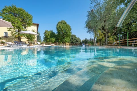 Seasonal outdoor pool, open 10:00 AM to 7:00 PM, sun loungers