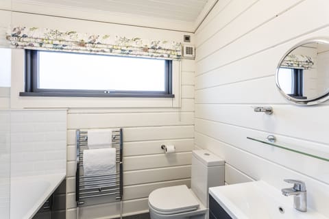 Roydon Lodge | Bathroom | Rainfall showerhead, free toiletries, hair dryer, towels