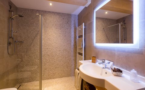 Suite, Jetted Tub | Bathroom | Free toiletries, hair dryer, bathrobes, slippers