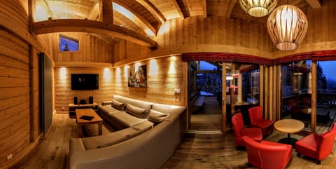 Chalet, 6 Bedrooms | Living area | Flat-screen TV