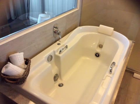 Deluxe Studio Suite, 1 King Bed, Sea View | Bathroom | Shower, free toiletries, hair dryer, towels