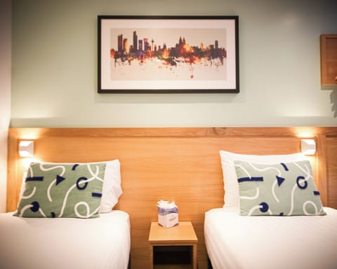 Standard Twin Room | Desk, laptop workspace, blackout drapes, iron/ironing board