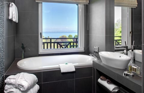 Suite, Lake View | Bathroom | Combined shower/tub, designer toiletries, hair dryer, bathrobes