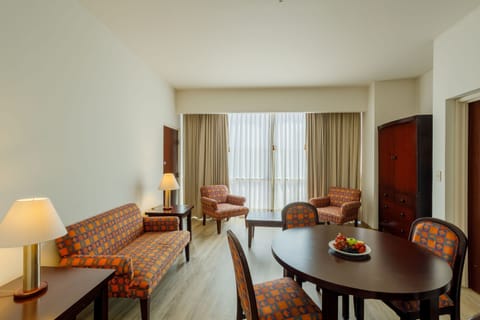 Junior Suite | Living area | 32-inch flat-screen TV with satellite channels, TV