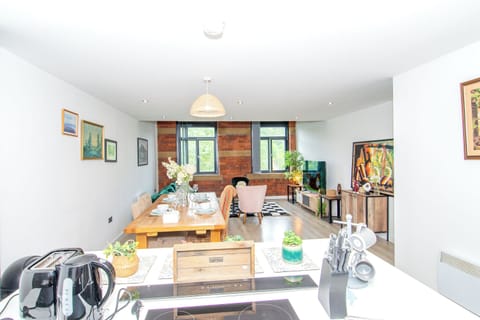 Family Apartment, Balcony, Garden View | Living area | 65-inch Smart TV with digital channels