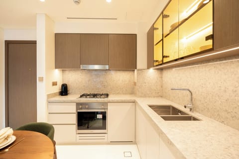 Deluxe Apartment, Balcony, Sea View | Private kitchen | Full-size fridge, microwave, oven, stovetop