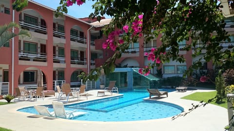 Outdoor pool, open 9:00 AM to 9:00 PM, pool umbrellas, sun loungers