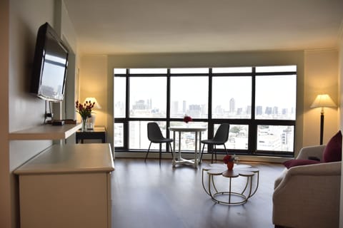 Suite, River View | Living area | LED TV