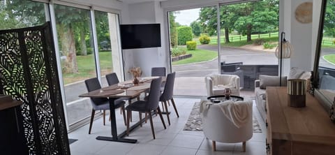 Comfort House, Garden View | Living area | 102-cm LED TV with digital channels