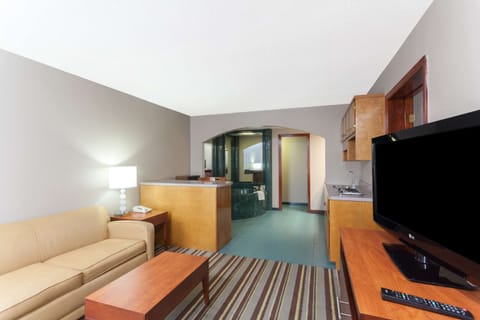 Suite, 1 King Bed, Non Smoking (One-Bedroom) | Desk, iron/ironing board, free cribs/infant beds, rollaway beds