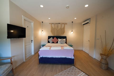 Deluxe Double Room, Balcony, Garden View | In-room safe, blackout drapes, soundproofing, iron/ironing board