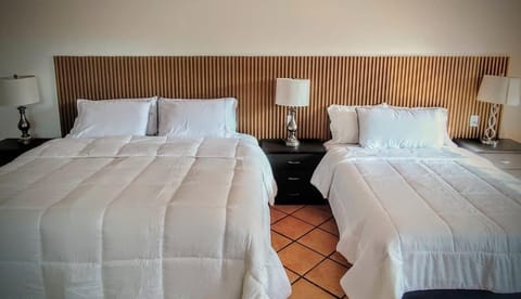 Down comforters, Select Comfort beds, laptop workspace, blackout drapes