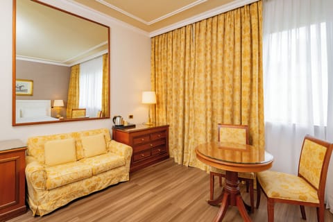 Deluxe Triple Room | Living area | LCD TV, pay movies