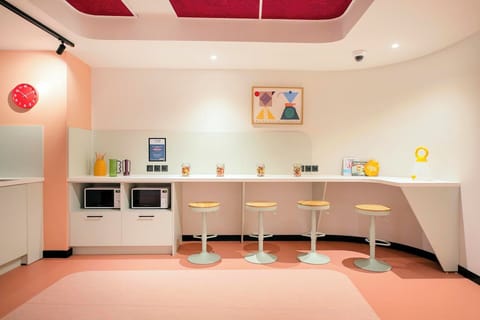 Fridge, microwave, stovetop, dining tables