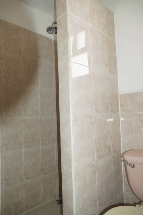 Deluxe Quadruple Room, Balcony, City View | Bathroom | Shower, towels, soap, shampoo