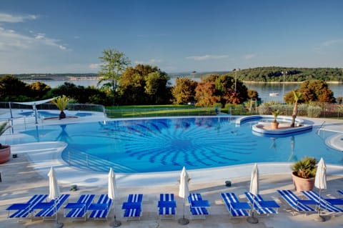2 outdoor pools, pool umbrellas, sun loungers