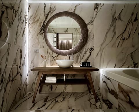 Junior Suite, 1 King Bed with Sofa bed | Bathroom | Hair dryer, slippers, bidet, towels