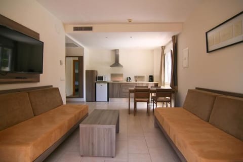 Apartment, Hot Tub, Ground Floor | Living area | 50-inch TV with satellite channels