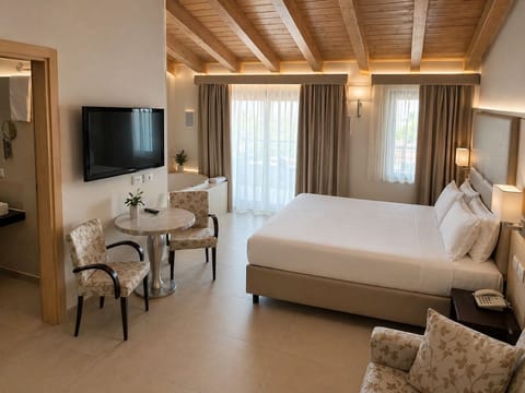 Suite, Lake View | Minibar, in-room safe, blackout drapes, iron/ironing board