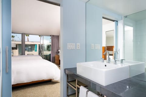 Deluxe Room | Bathroom | Designer toiletries, hair dryer, bathrobes, towels