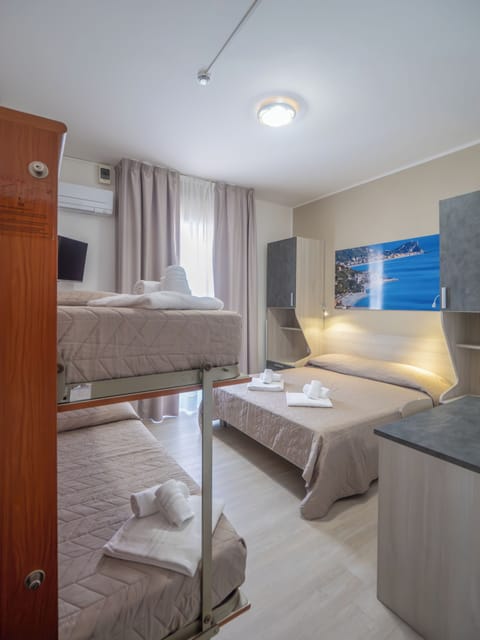 Quadruple Room, Balcony | In-room safe, laptop workspace, travel crib, free WiFi