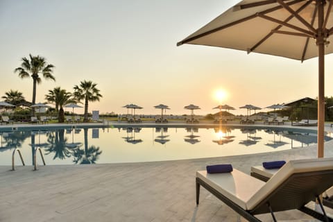 Indoor pool, outdoor pool, pool umbrellas