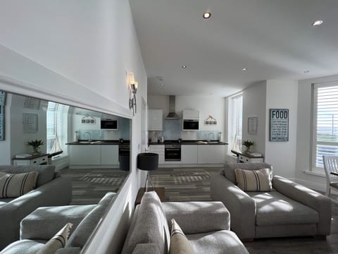 Family Apartment, Balcony, Sea View | Living area | 40-inch Smart TV with digital channels, Netflix, streaming services